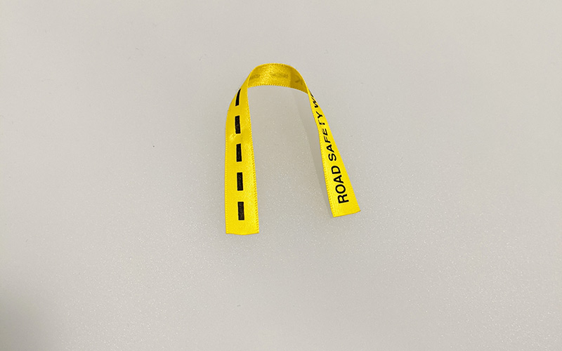 Short piece of yellow ribbon