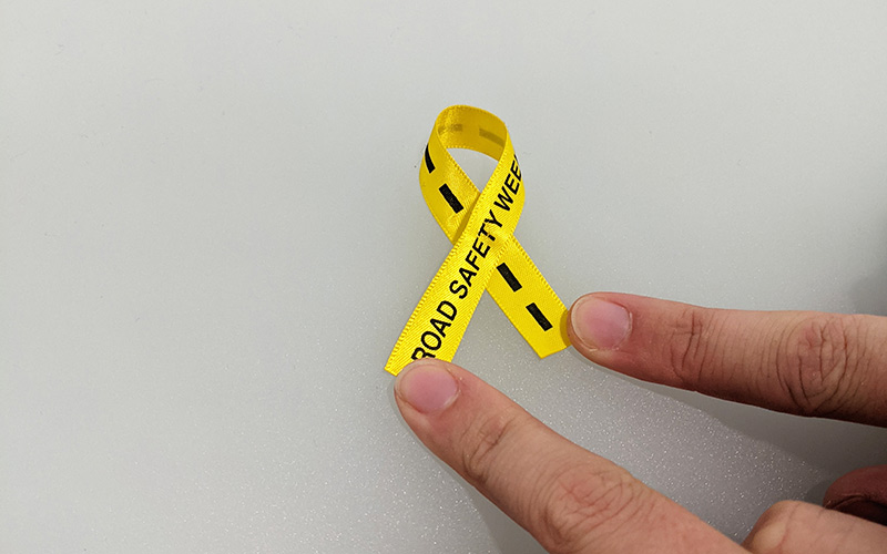 Yellow ribbon folded over each other.
