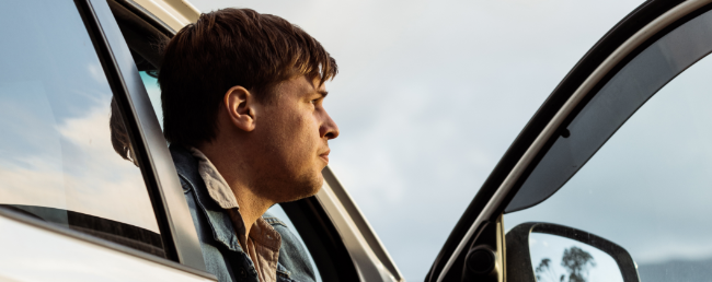 man in car