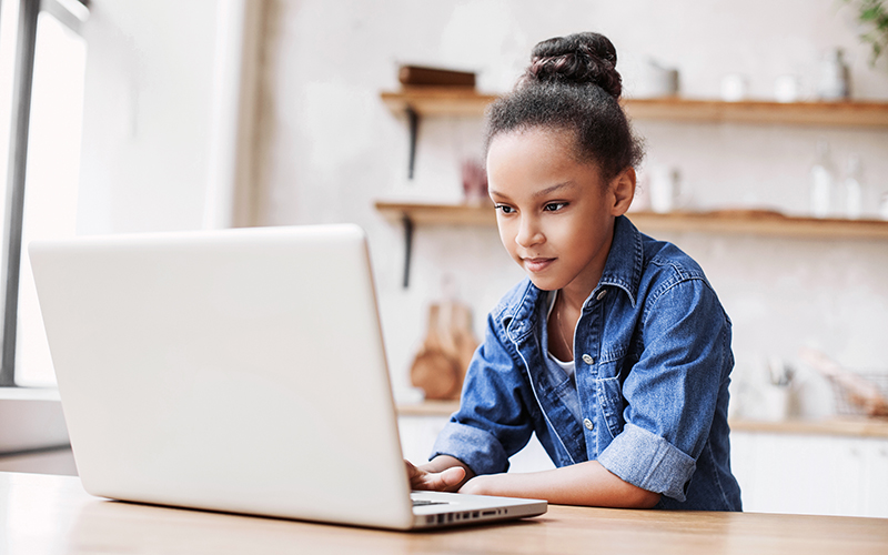 Young girl learning at home