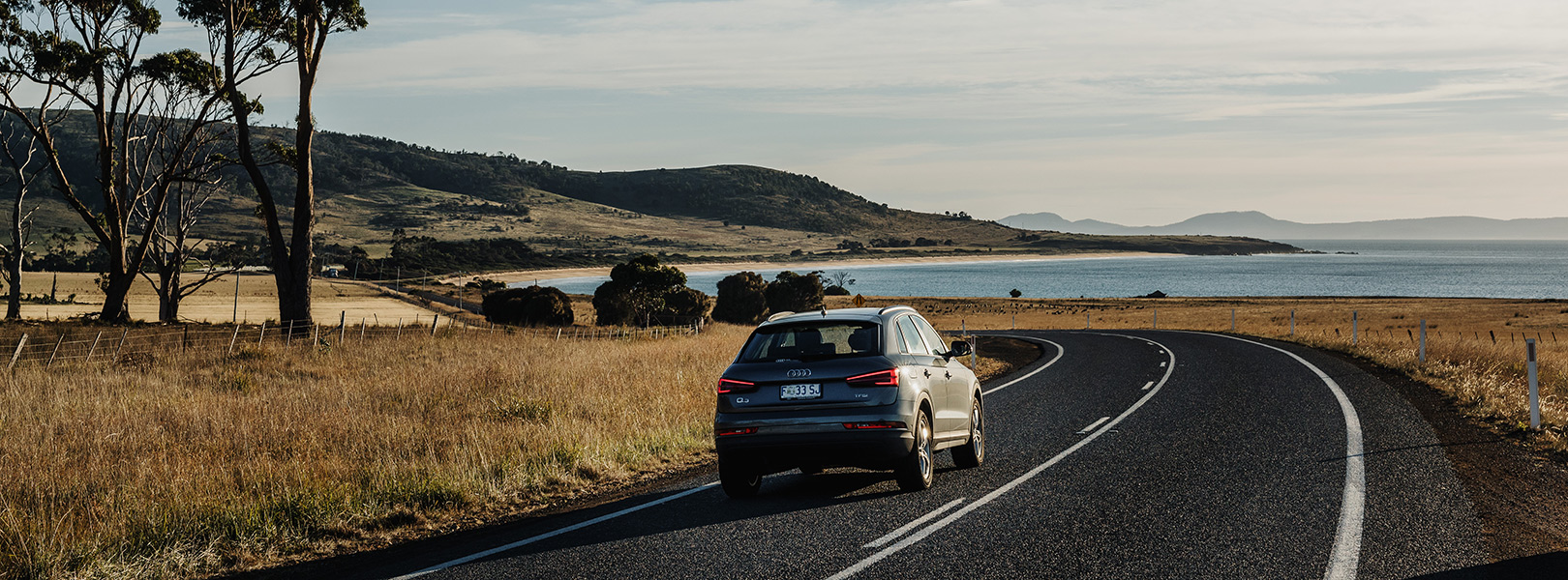 Image of car driving on Tasmania's East Coast.