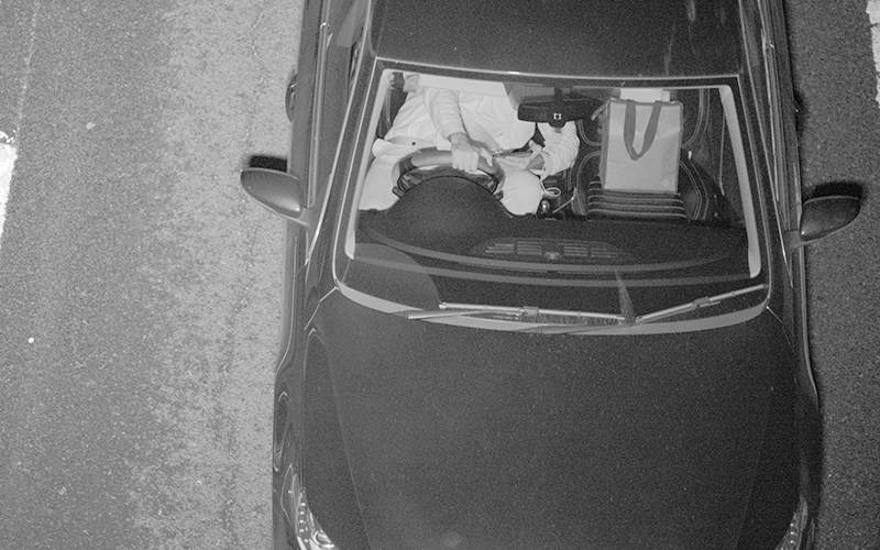 Speed camera image of someone texting and driving