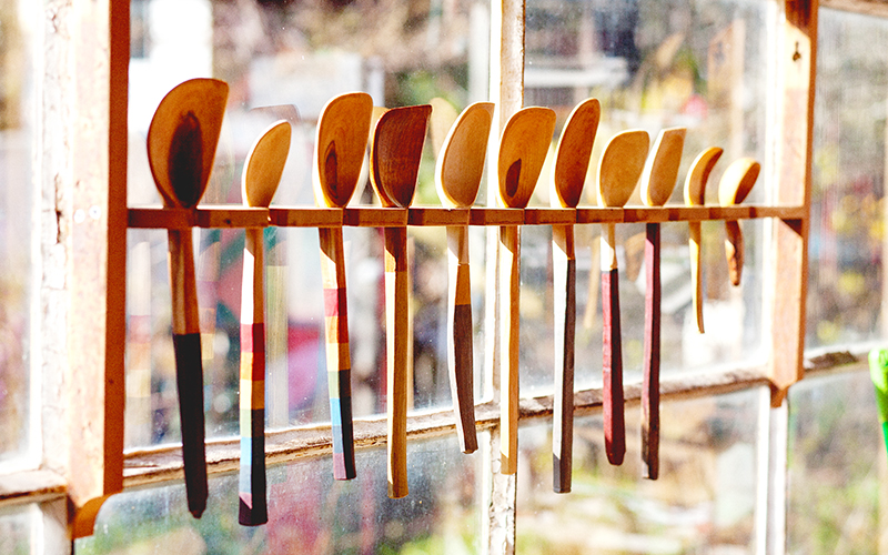 Spoons hanging up by the window