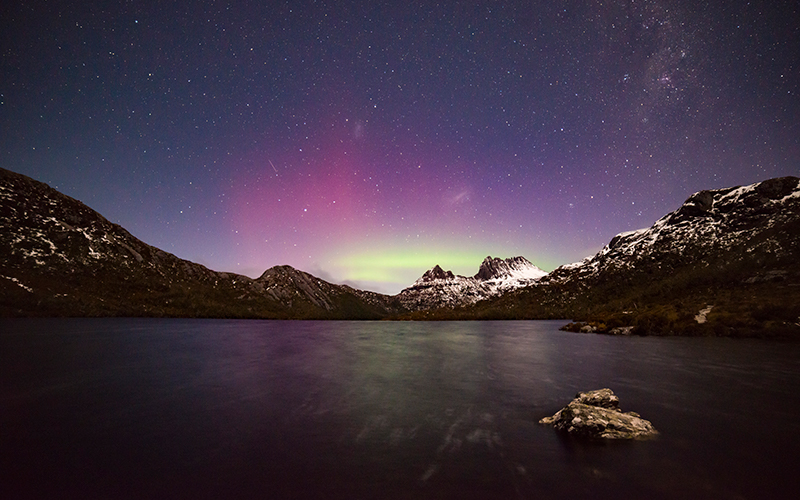 Purple, pink and green aurora at Cradle Mountain