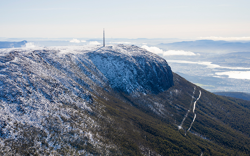 Aerial view of Mt Wellington covered in snow