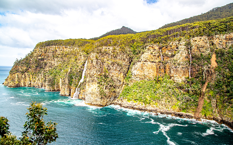 Cliff and water views of Waterfall Bay on the Tasman Peninsula
