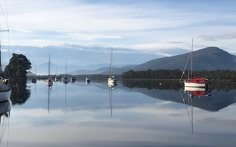 Clouds and sky reflected on the Huon River