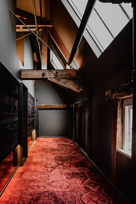 Red carpet hallway at Stillwater Seven in Launceston