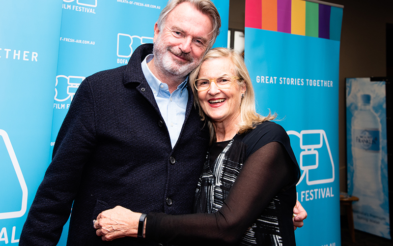 Sam Neill and woman at the Breath of Fresh Air Film Festival
