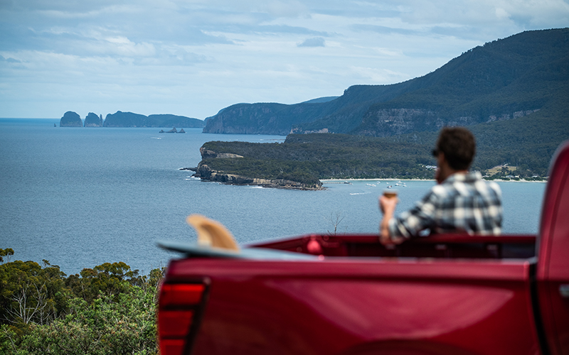 Looking out over Pirates Bay in the red Mazda BT-50