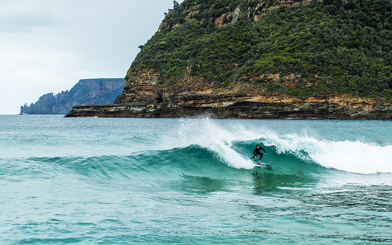 Surfer catching a wave