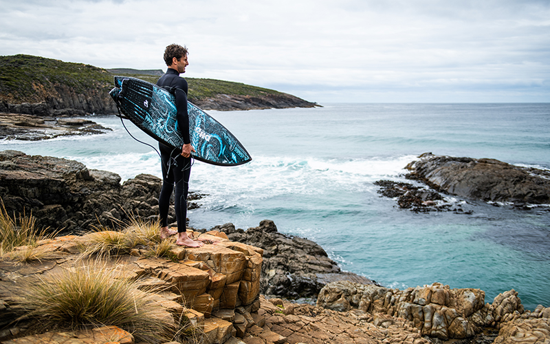 Surfing looking out at waves