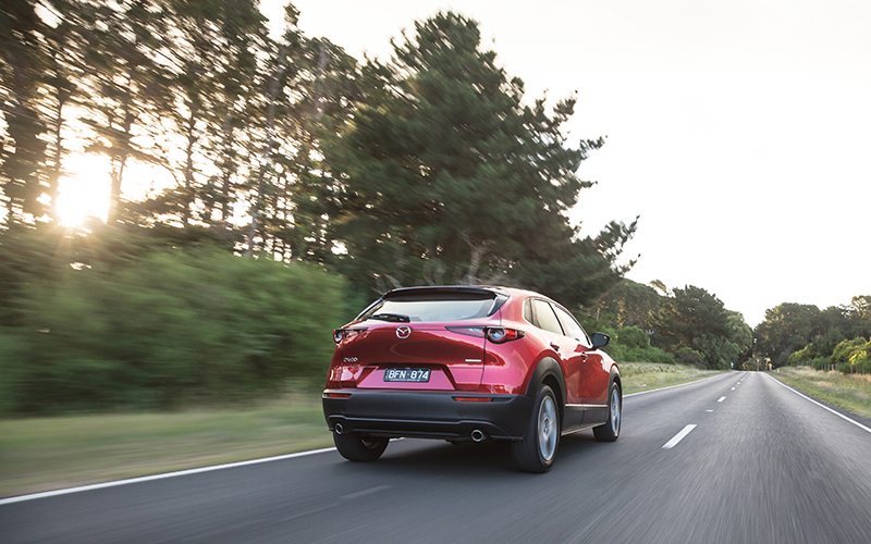 Red Mazda CX30 on highway