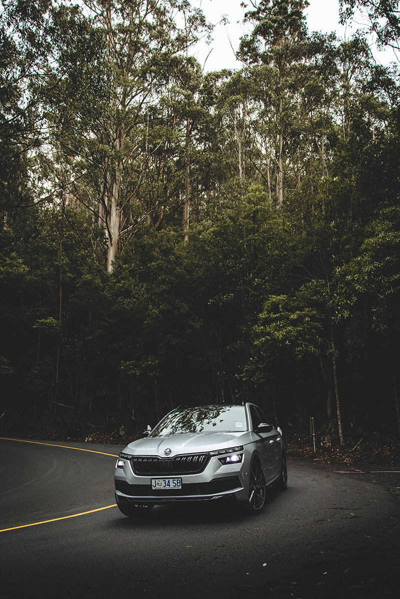 Silver Skoda Kamiq driving down road on Mount Wellington
