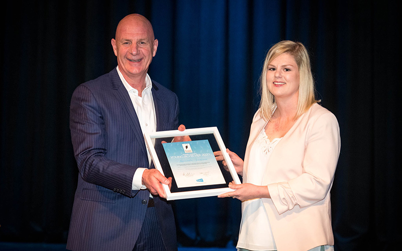Amanda Sansom accepting her award with Premier Peter Gutwein
