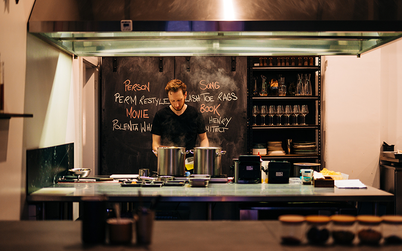 Bar tender making drinks