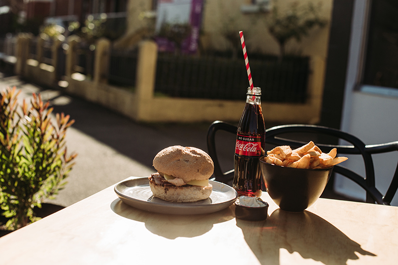 Burger, coke and chips on table at BGS in Launceston.