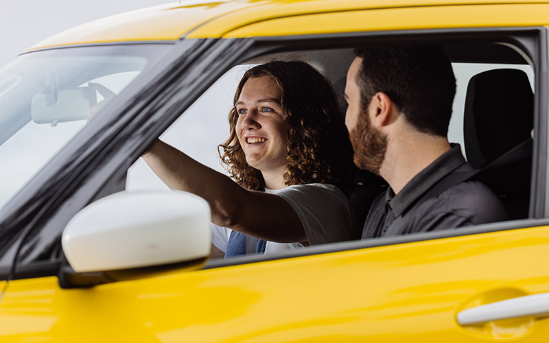 Driver Trainer taking a student for a driving lesson.