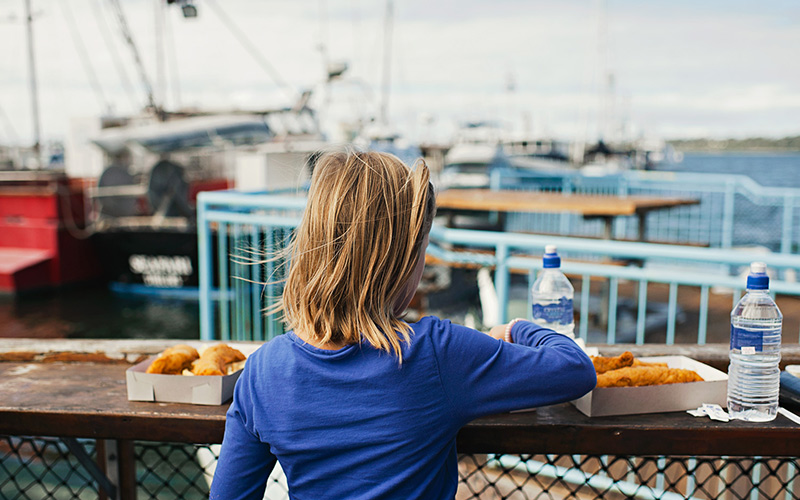 Eating fish and chips by the bay